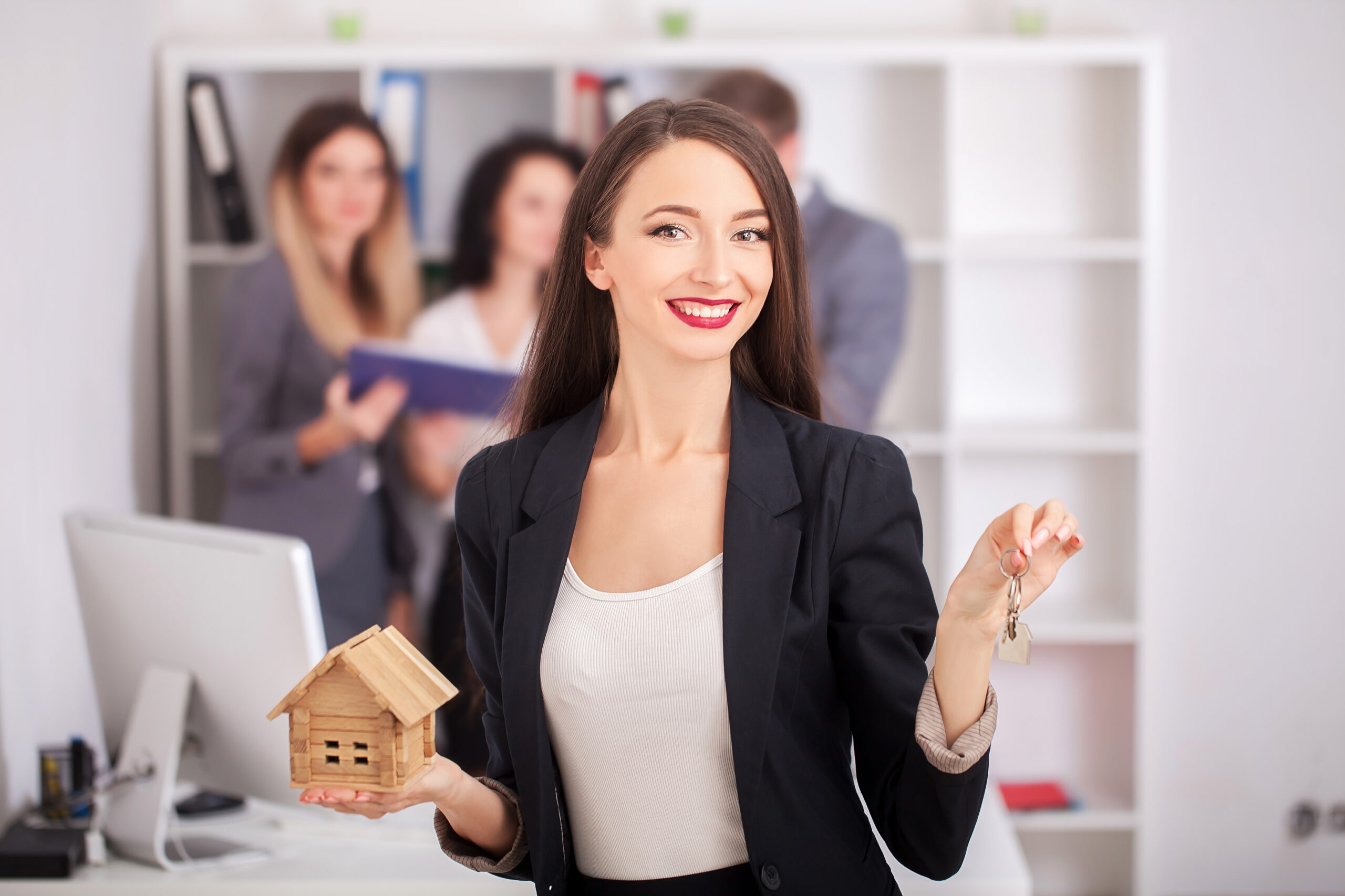 Real estate agent portrait with family getting new home. business concept about real estate market